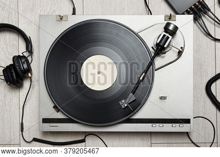 Vinyl Player With Long Play Or Lp Record And Old-fashion Headphones. Top View.