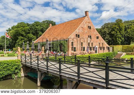 Uithuizen, Netherlands - July 29, 2020: Bridge And Restaurant At The Menkemaborg Building In Groning