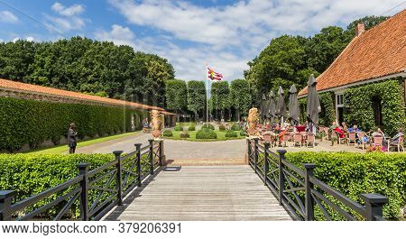 Uithuizen, Netherlands - July 29, 2020: Bridge And Restaurant At The Menkemaborg Building In Groning