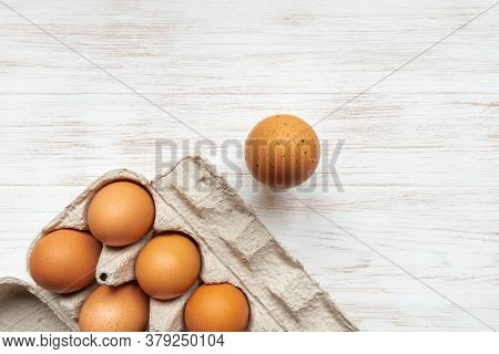 Free-range Organic Eggs In Cardboard Box. Close-up Brown Eggs In Recycled Cardboard Box And One Near