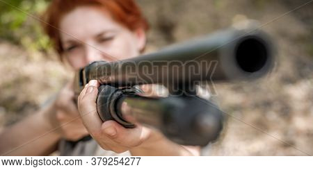 Woman Shooting With Pump Gun. Shotgun Front View Gun Point