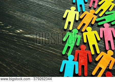 Diversity And Inclusion Background On The Dark Wooden Desk With Free Space.