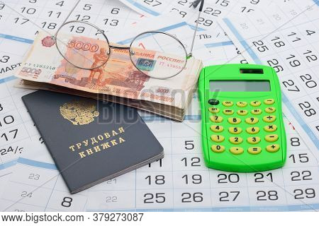 Business Still Life From A Bundle Of Five Thousandth Bills, A Calculator, Glasses And A Work Book