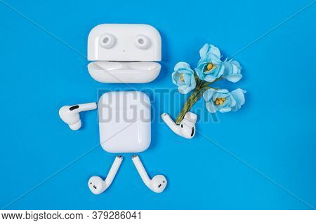 Rostov, Russia - July 06, 2020: Funny Man With Arms, Legs And Eyes Made Of Apple Wireless Headphones