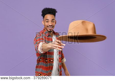 Smiling Young African American Guy In Casual Colorful Shirt Posing Isolated On Violet Wall Backgroun