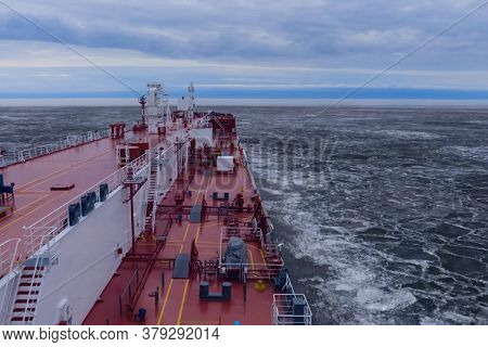 The Feed Of A Ship Sailing In The Arctic. Landscape Of The Arctic From The Deck Of The Tanker.