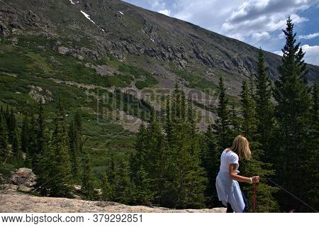 Lady Hiker Working Her Way Down A Rocky Incline