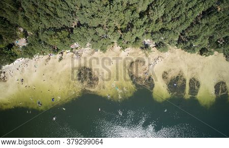 People On Lake Beach