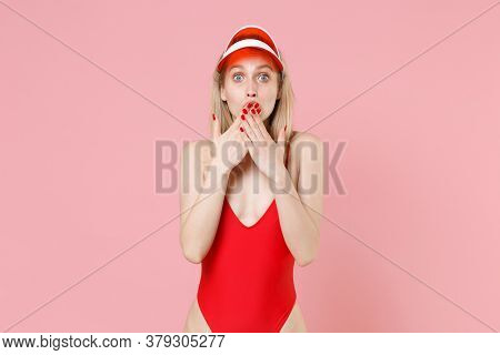 Shocked Young Blonde Woman Girl In Red One-piece Swimsuit Cap Posing Isolated On Pink Background Stu