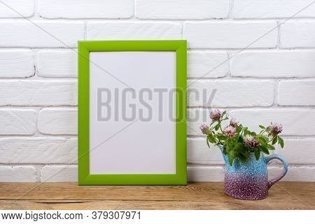 Green Poster Frame Mockup With Pink Clover In Pitcher