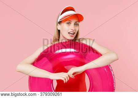 Attractive Young Blonde Woman Girl In Red One-piece Swimsuit Cap Posing Isolated On Pink Wall Backgr