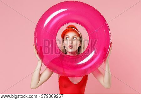 Amazed Young Blonde Woman Girl In Red One-piece Swimsuit Cap Isolated On Pink Background. People Sum