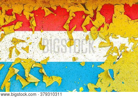 The National Flag Of Luxembourg Is Painted On An Old Metal Wall With Ragged Paint. Country Symbol.