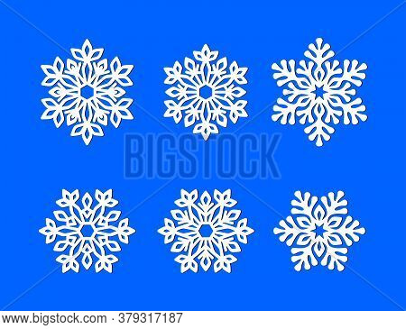 Set Of White Openwork Snowflakes On A Blue Background. Vector Silhouette, Design Template For Holida