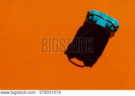Blue Alarm Clock On Orange Background. Back To School Concept. Creative Design, Minimal Concept. Wak