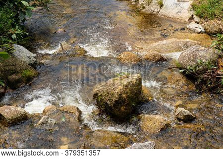 Mountain River Flowing Over The Stones. Wildlife Beauty In Malaysia