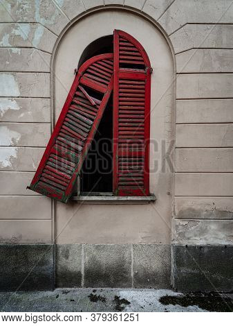 Red Doors Of A Window Of An Old Dilapidated Italian Building Of The Twentieth Century, Urbex Image