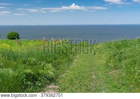 Spring Landscape With An Earth Road Leading Down To Kakhovka Reservoir Riverside Located On The Dnip