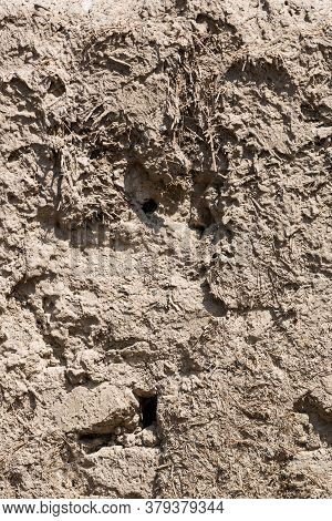 Mud And Clay Background. Old Traditional Building Material Made Of A Mixture Of Clay, Grass, Straw. 