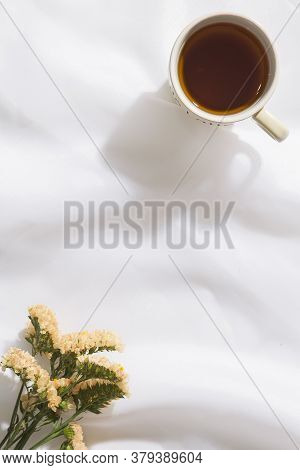 Top View Of Voile Fabric Background With Flowers In Two Corners With Space For Text