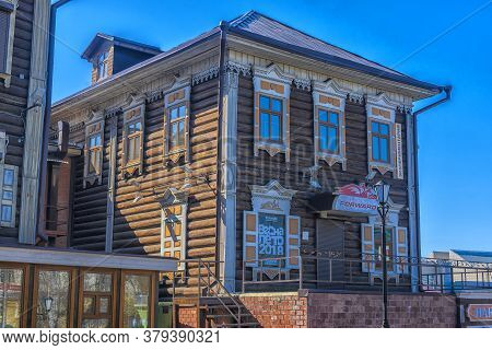 Wooden Architecture Of Siberia. Wooden Houses On Streets In The Center Of Irkutsk