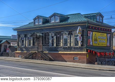 Wooden Architecture Of Siberia. Wooden Houses On Streets In The Center Of Irkutsk