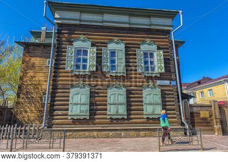 Russia, Irkutsk 06,05,2018 Wooden Architecture Of Siberia. Wooden Houses On Streets In The Center Of