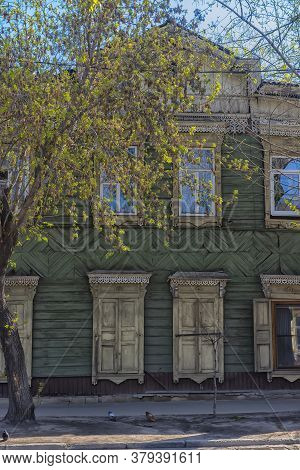Russia, Irkutsk 06,05,2018 Wooden Architecture Of Siberia. Wooden Houses On Streets In The Center Of