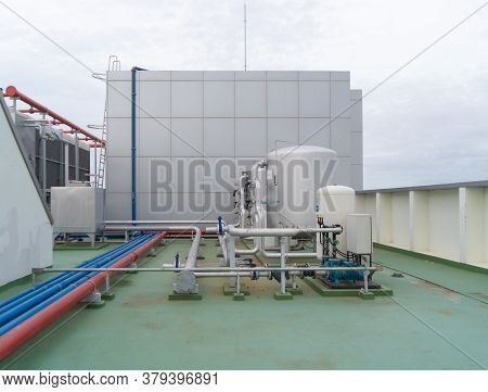 Chiller Tower Or Cooling Tower On Rooftop Of A Office Building. System Work. Architecture Machine. C