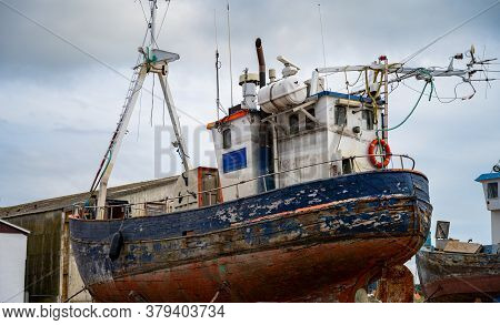 Hundested, Denmark - August 2, 2020: An Old Fishing And Tour Boat In A Dry Dock For Maintenance And 