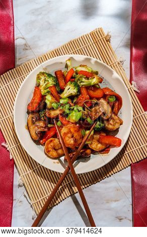 Chinese Shrimp With Mixed Sauteed Vegetables In A Brown Garlic Sauce