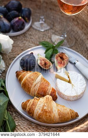 Vertical Image Of Croissants, Figs And Camamber Cheese In A Minimalistic White Plate.