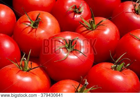 Close-up Of Mellow Red Tomatoes On Market Counter