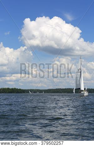 Masuria, Poland - June 24, 2020 : Lake In Polish Masuria, Sailing Yachts On A Sunny Day. Picturesque