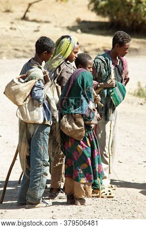 SIMIEN MTNS, ETHIOPIA - JANUARY 12: Ethiopean children are selling crafts in Simien mountains, Ethiopia on January 12, 2010.