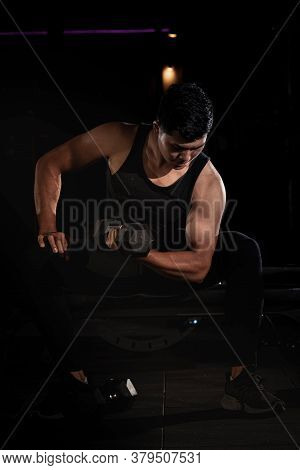 Handsome Man Raising Dumbbell,doing Exercise For Buit Muscle,fit And Firm Body,model Posing