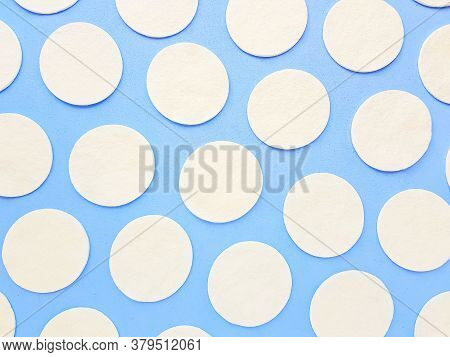 Cotton Cotton Cotton Discs On A Blue Background. Cosmetology And Medicine. Taking Care Of Yourself.