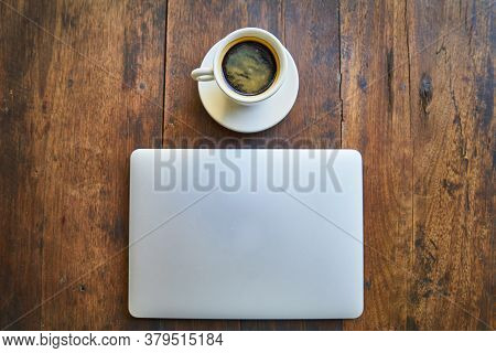 Hot Healthy And Tasty Coffie Drink On The Cup With Notebook