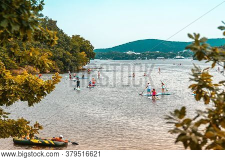 Brno Prygl, Czech Republic - August 2, 2020: Paddle Group On The Lake. Paddleboard People On Stand U