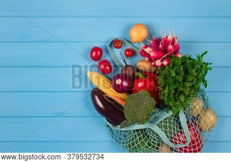 Cotton Bag Full Of Fresh Farm Raw Vegetables From Local Farmer Market, On Blue Wooden Background Or 
