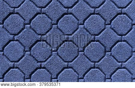Closeup Surface Of Blue Old Octagonal Almost Circular Paving Slabs, Uneven Worn Surface With Sunken 