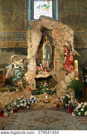 GRUBISNO POLJE, CROATIA - OCTOBER 01, 2011: Cave of Our Lady of Lourdes at Saint Joseph Parish Church in Grubisno Polje, Croatia