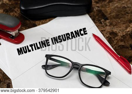Multiline Insurance, An Effective Insurance Tool. Text On White Paper, Next To Black Glasses, Red Pe