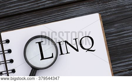 Linq (language Integrated Query) - Word Written In A Notebook On A Dark Beautiful Background With A 