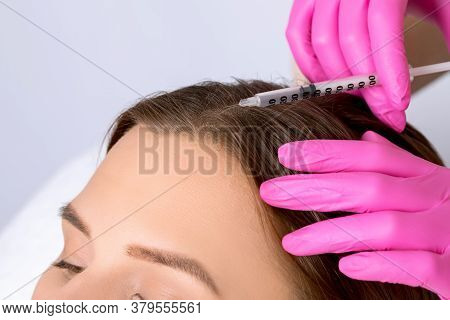 Cosmetologist Does Prp Therapy Against Hair Loss And Anti-dandruff Of A Beautiful Brunette Woman In 