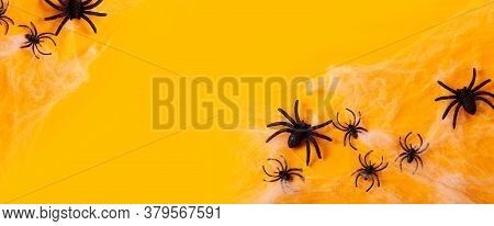 Halloween Flat Lay Scene On Orange Background With Spiders, Benner With Copy Space