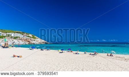 CALA MESQUIDA, MALLORCA, SPAIN - 19 July 2020: People enjoying beautiful sandy beach of on Mallorca, Mediterranean Sea, Balearic islands, Spain.