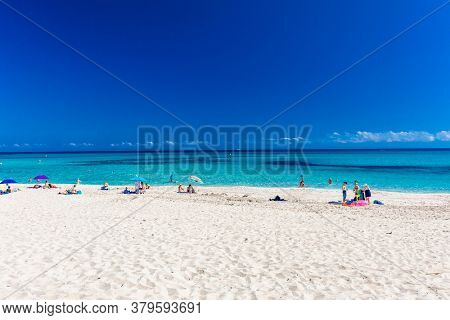 CALA MESQUIDA, MALLORCA, SPAIN - 19 July 2020: People enjoying beautiful sandy beach of on Mallorca, Mediterranean Sea, Balearic islands, Spain.