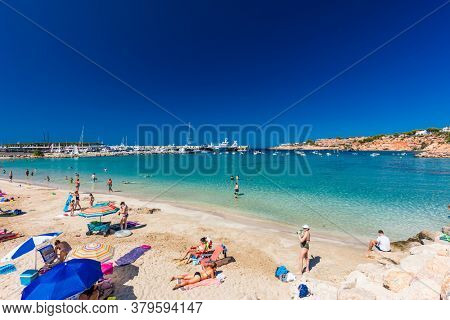 PORT ADRIANO, MALLORCA, SPAIN - 23 July 2020 - Tourists enjoying summer day on the popular city beach.