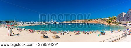 PORT ADRIANO, MALLORCA, SPAIN - 23 July 2020 - Tourists enjoying summer day on the popular city beach.